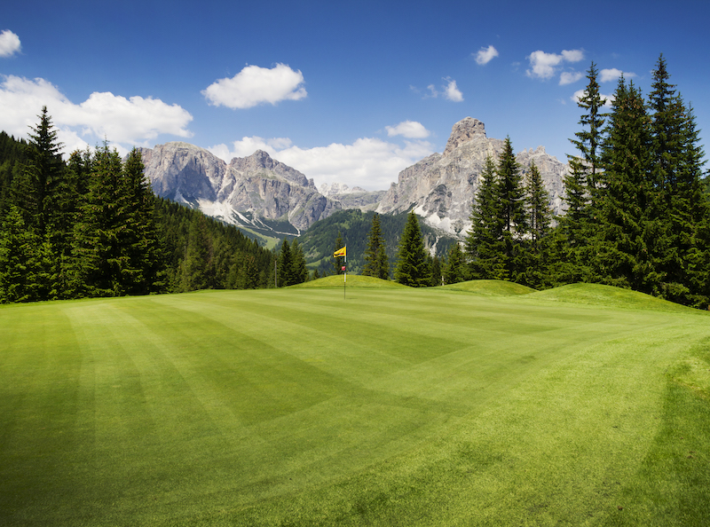 golf course along mountains