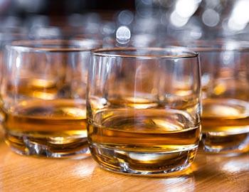 Whiskey in tasting glasses at a distillery