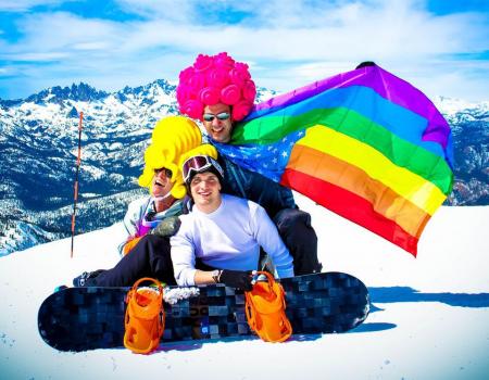 Friends on Mammoth Mountain with colorful flags and attire