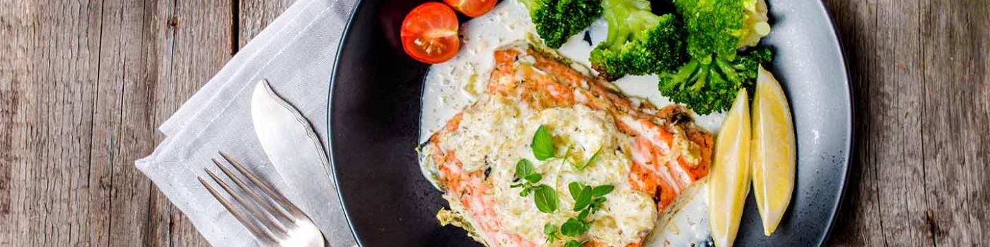 Fish and vegetables meal at an American cuisine restaurant