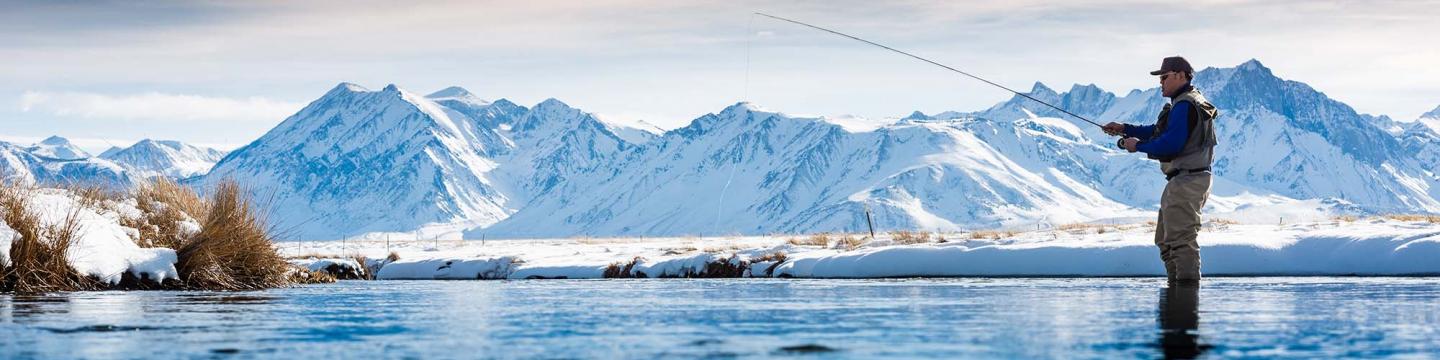 Fisherman fishing in the winter near Mammoth Lakes