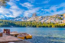 Boats at dock on Lake George under Crystal Crag at Mammoth Lakes, CA.