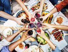 People toasting over dinner