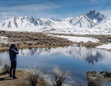 Photographer taking photos of the mountain in Mammoth