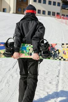 Man walking with snowboard