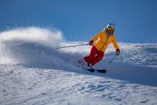 Skier in orange jacket