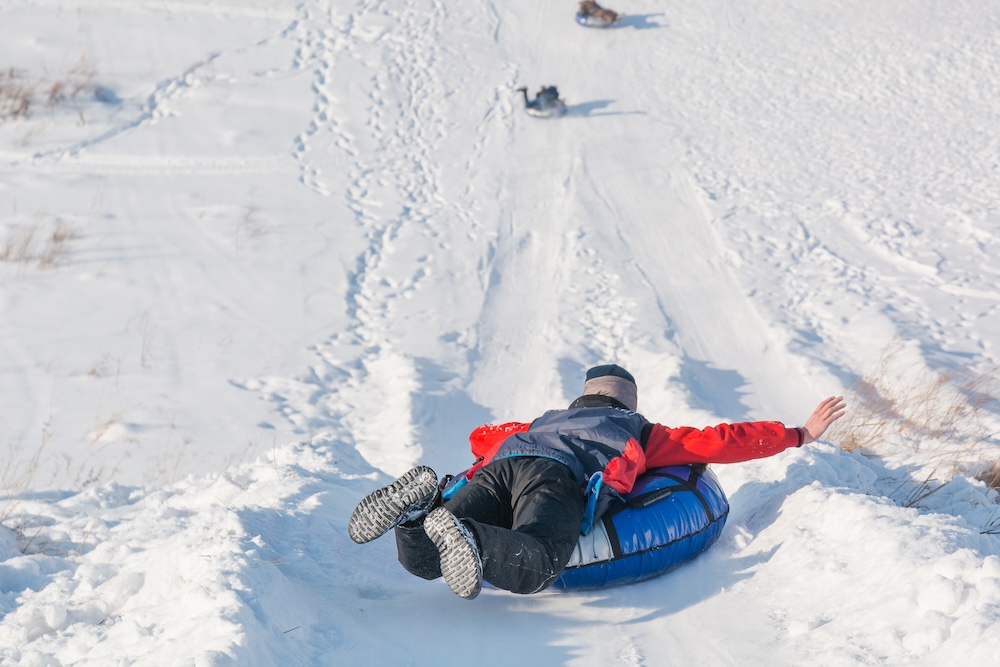 Children going snow tubing.