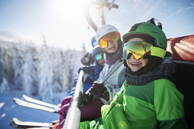 Family on a ski lift in Mammoth Lakes, CA