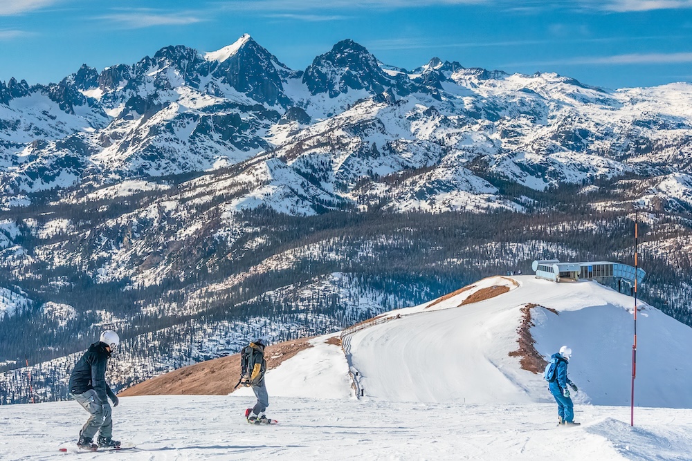 Snowboading with friends on the last run of the day.