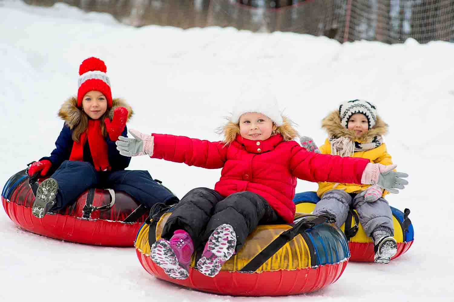 Kids enjoying tubing in Mammoth Lakes, California