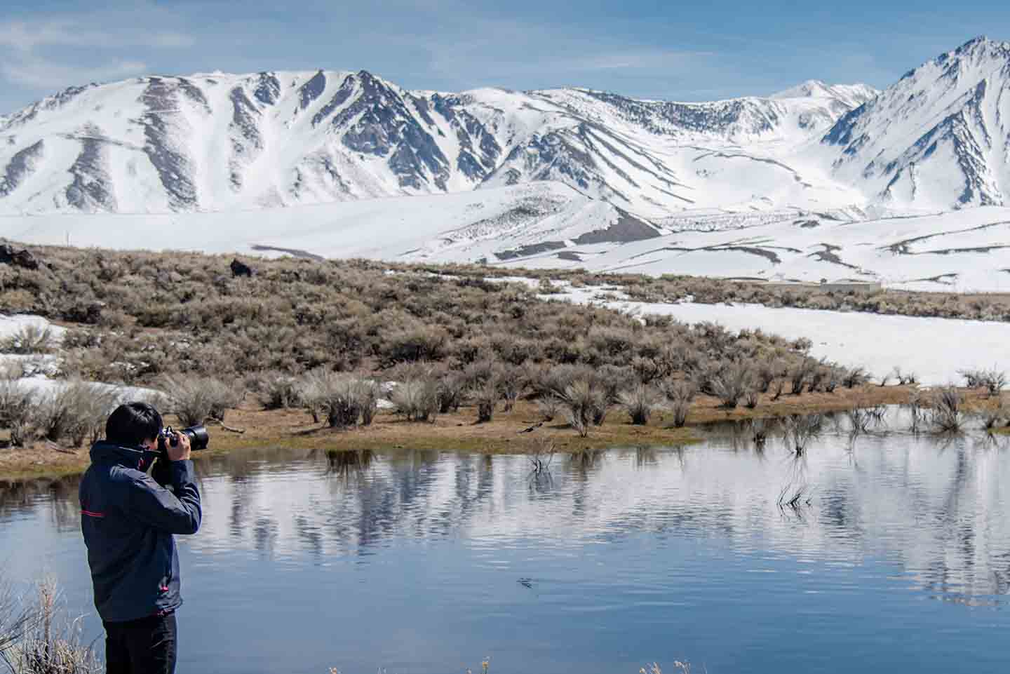 Photographer taking a photo in the winter at Mammoth